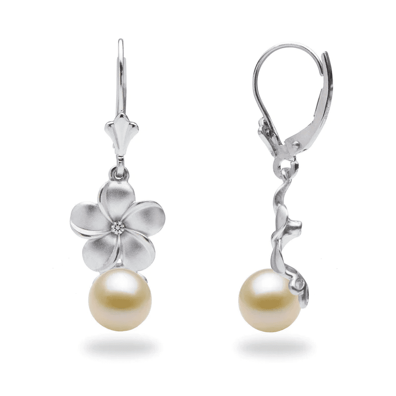 A pair of earrings with pearls and diamond