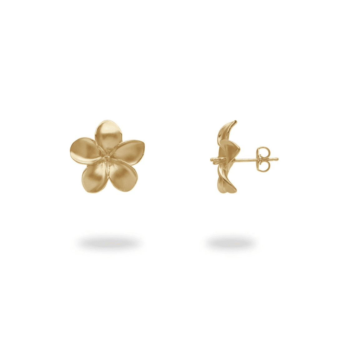 A pair of gold earrings with flowers on them.